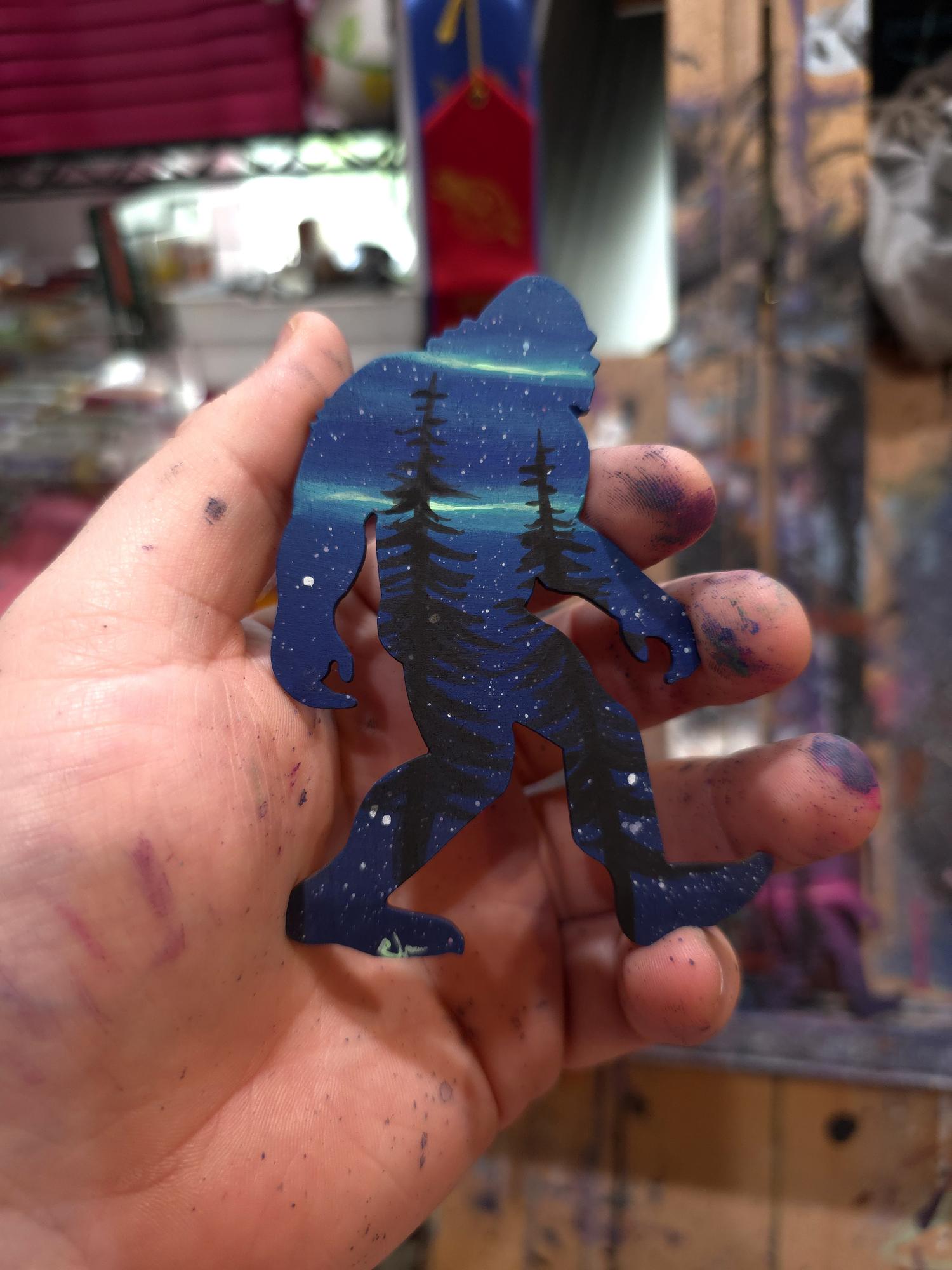 Deep blue Sasquatch sample with pine tree silhouettes and stars